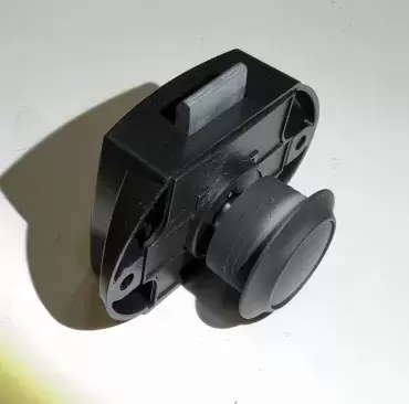 Black push-button closure with rosette for drawers and cabinets in caravans, motorhomes and campers.